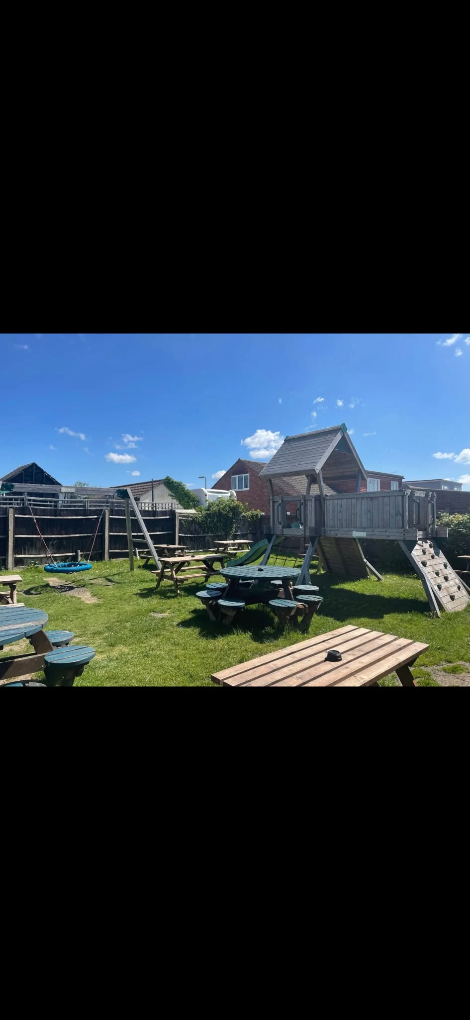 The Falcon outside play area and picnic tables