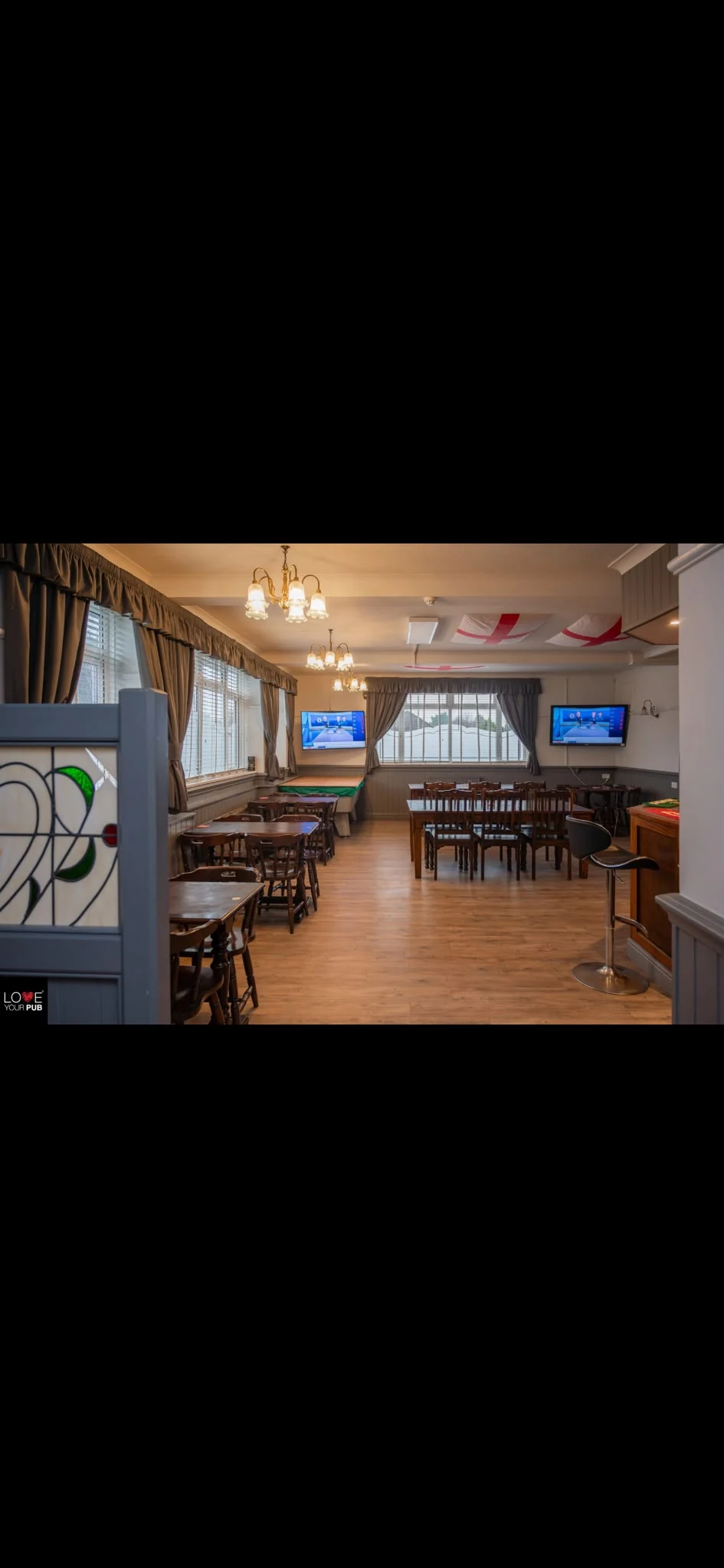 Tables and screens inside The Falcon