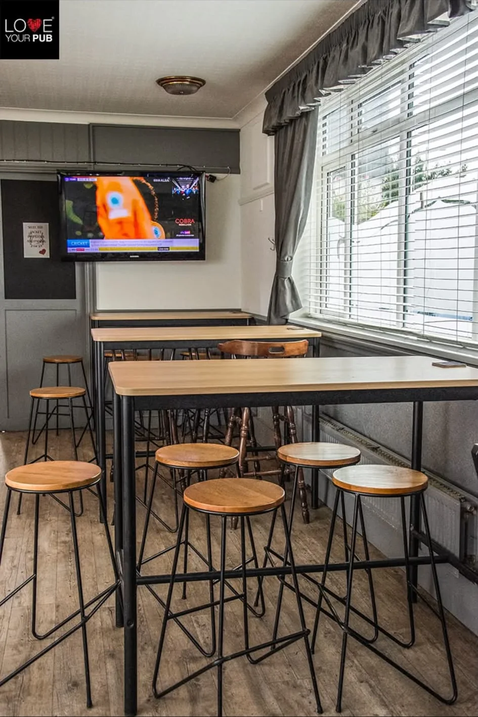 Tables and television showing sport at The Falcon